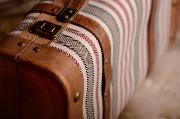 Small red striped suitcase