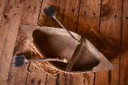 Brown rustic rowboat with oars