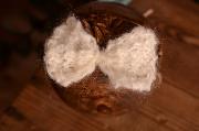 White mohair bow with rope