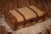 Small beige suitcase