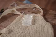 Beige mohair short dungaree with bow and pearls