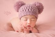 Pink hat with pompoms