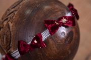 White and burgundy Christmas headdress with bows