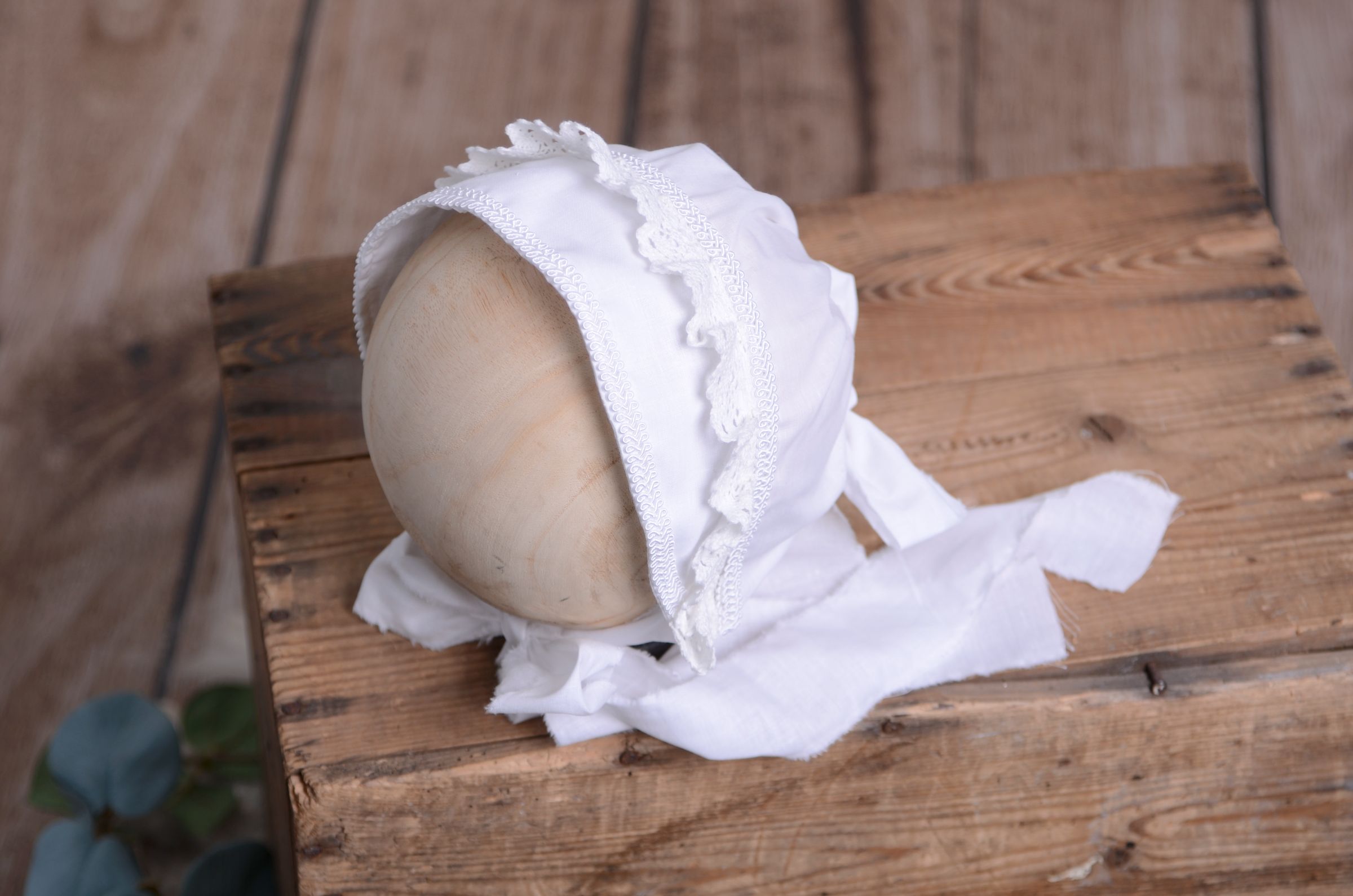 White fabric bonnet for baby