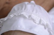 White fabric bonnet for baby