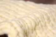 Light yellow plaited blanket