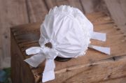 White fabric bonnet for baby