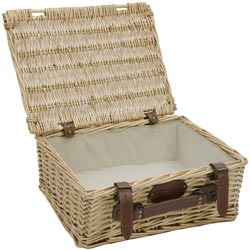 Empty wicker basket with cream fabric